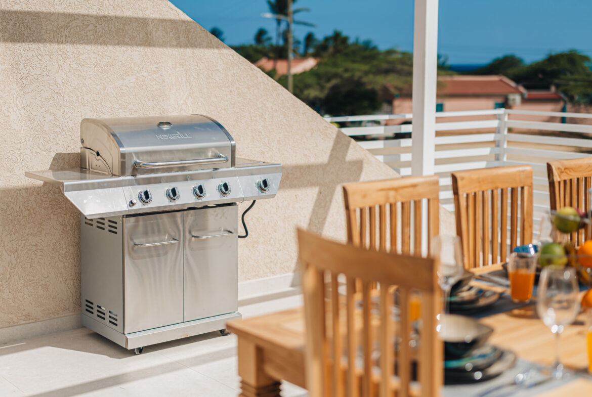 Rooftop terrace with built-in gas grill and outdoor dining area, Seaside Modern Villa, Aruba