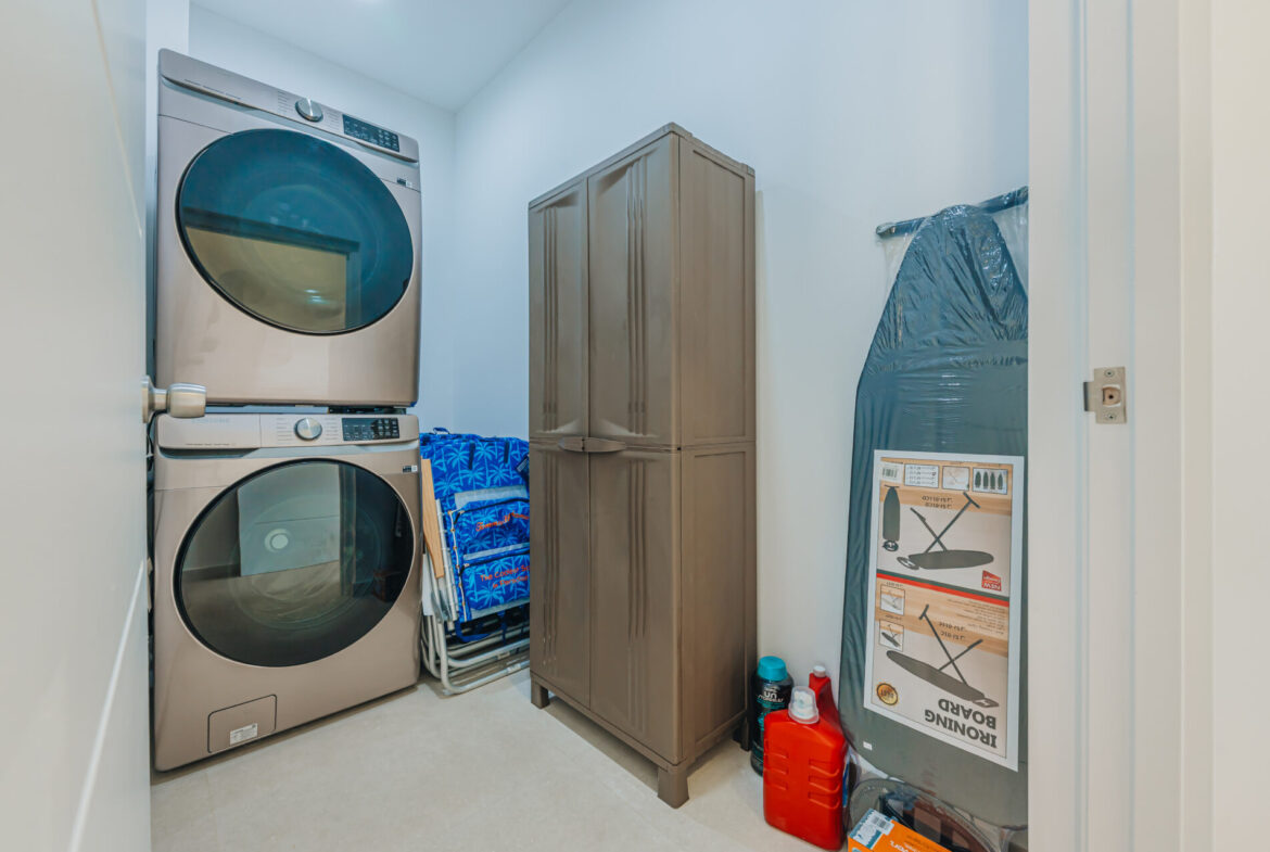 Laundry closet with stacked washer and dryer, Seaside Modern Villa, Aruba